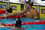 Italy's Nicolo Martinenghi celebrates taking gold in the men's 100m breaststroke finals the Budapest 2022 World Aquatics Championships at Duna Arena in Budapest on June 19, 2022. (Photo by Ferenc ISZA / AFP)