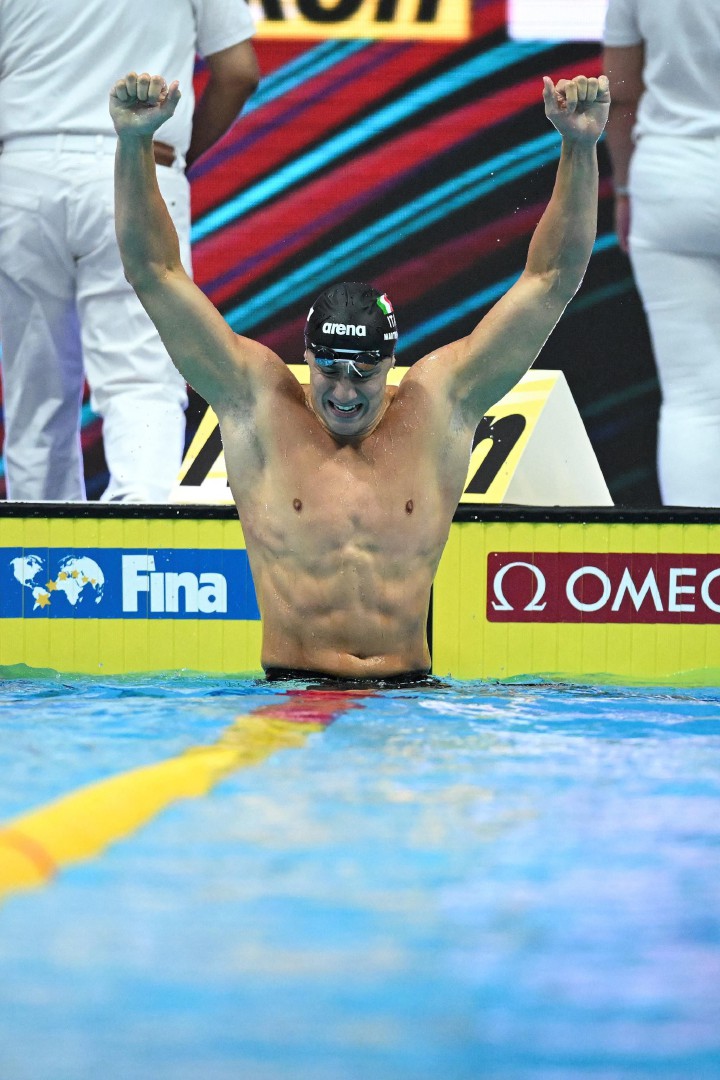 Italy's Nicolo Martinenghi celebrates taking gold in the men's 100m breaststroke finals the Budapest 2022 World Aquatics Championships at Duna Arena in Budapest on June 19, 2022. (Photo by Ferenc ISZA / AFP)