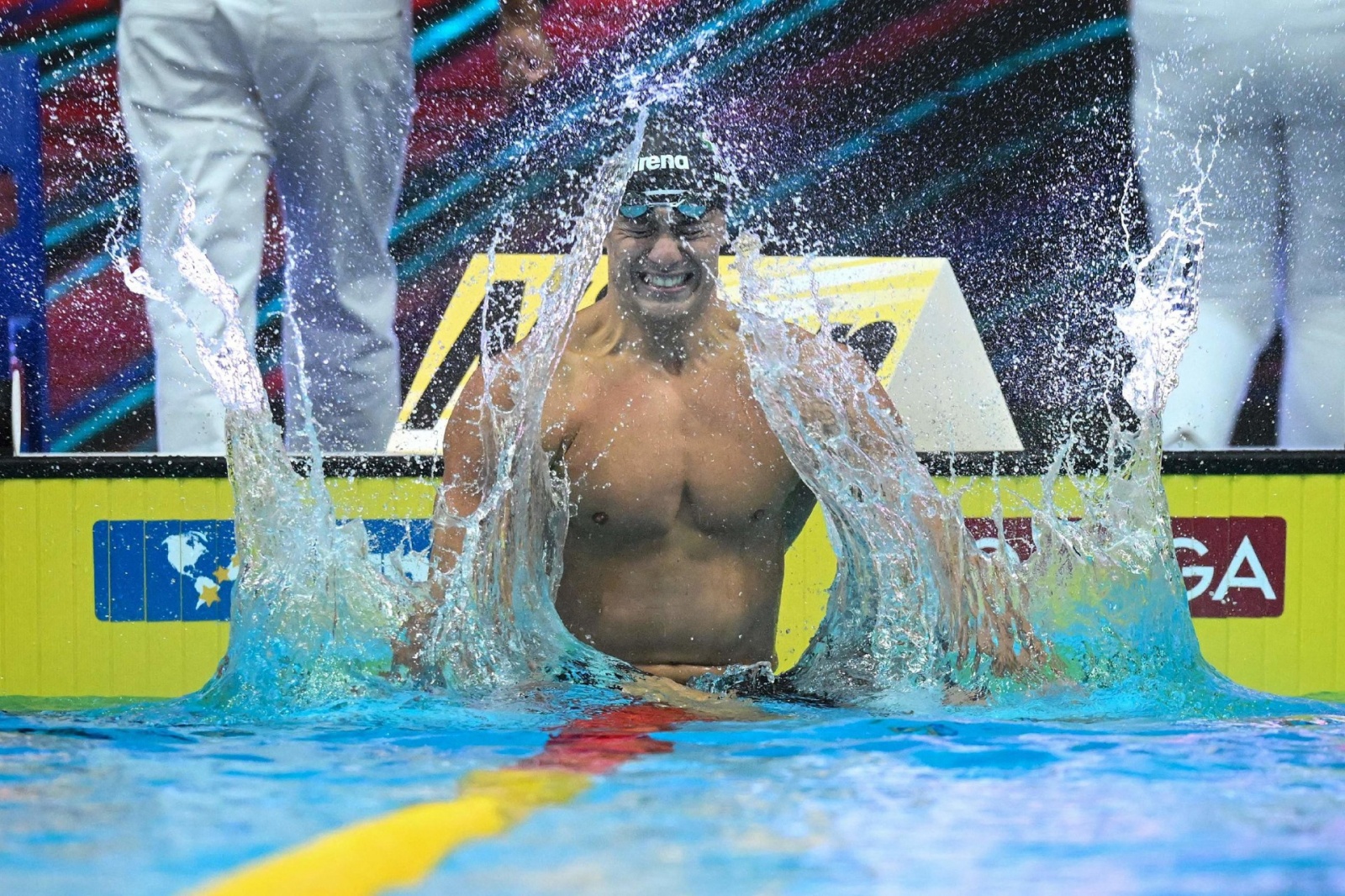 Italy's Nicolo Martinenghi celebrates taking gold in the men's 100m breaststroke finals the Budapest 2022 World Aquatics Championships at Duna Arena in Budapest on June 19, 2022. (Photo by Ferenc ISZA / AFP)