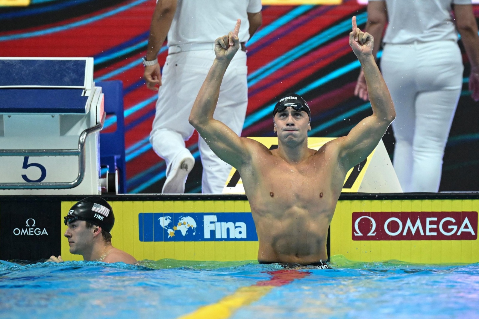 Italy's Nicolo Martinenghi celebrates taking gold in the men's 100m breaststroke finals the Budapest 2022 World Aquatics Championships at Duna Arena in Budapest on June 19, 2022. (Photo by Ferenc ISZA / AFP)