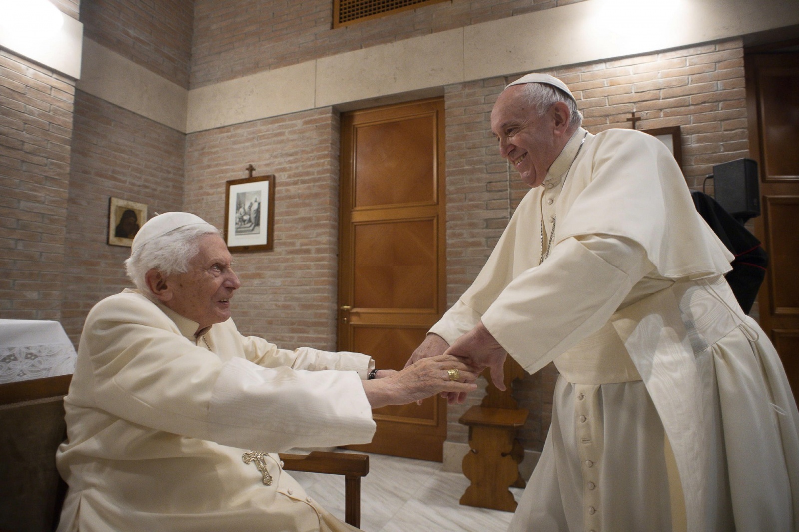 epa08849568 A handout picture provided by the Vatican Media shows Pope Francis (R) visit the Pope Emeritus, Benedict XVI, in the chapel of the Mater Ecclesiae monastery, Vatican City, 28 November 2020. Pope Francis installed 13 new Cardinals, including th