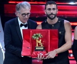 Italian singers Marco Mengoni receives the trophy after winning from Alberto Biancheri, Mayor of Sanremo on stage at the Ariston theatre during the 73rd Sanremo Italian Song Festival, in Sanremo, Italy, 11 February 2023. The music festival will run from 0