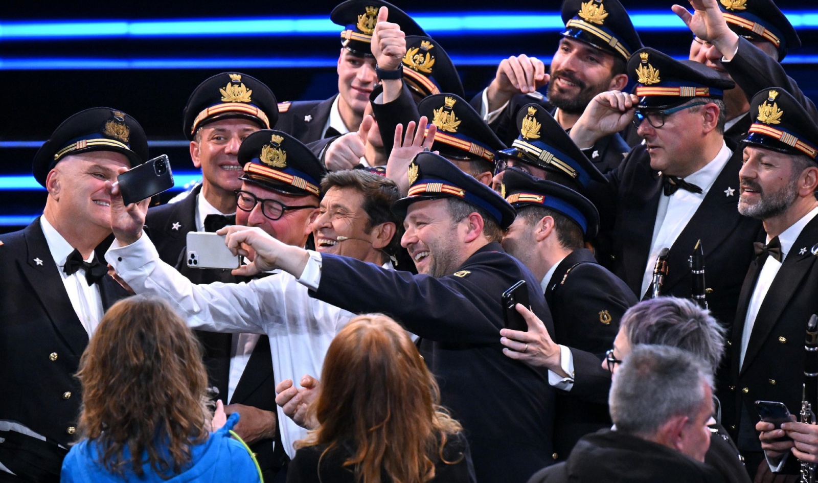Italian singer and Sanremo Festival co-host Gianni Morandi with National Air Force band members on stage at the Ariston theatre during the 73rd Sanremo Italian Song Festival, in Sanremo, Italy, 11 February 2023. The music festival will run from 07 to 11 F