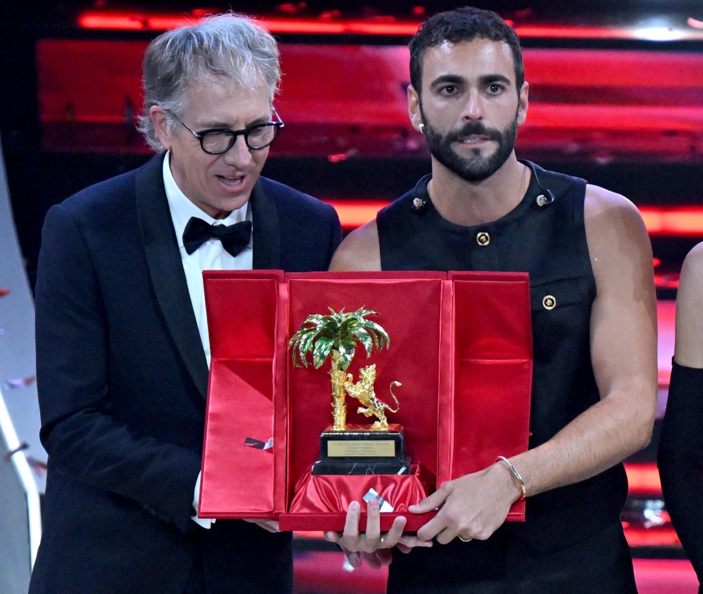 Italian singers Marco Mengoni receives the trophy after winning from Alberto Biancheri, Mayor of Sanremo on stage at the Ariston theatre during the 73rd Sanremo Italian Song Festival, in Sanremo, Italy, 11 February 2023. The music festival will run from 0