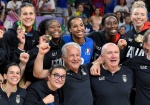 Italy's players with their coach Julio Velasco celebrate on the podium after winning the Women's gold medal match between USA and Italy of the Volleyball competitions in the Paris 2024 Olympic Games, at the South Paris Arena in Paris, France, 11 August 20