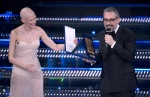 Italian singer Brunori Sas receives the Sergio Bardotti award from Italian model Bianca Balti on stage at the Ariston theatre during the 75th edition of the Sanremo Italian Song Festival, in Sanremo, Italy, 15 February 2025. The music festival will run fr