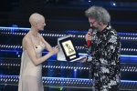 Italian singer Simone Cristicchi receives the Giancarlo Bigazzi award from Italian model Bianca Balti on stage at the Ariston theatre during the 75th edition of the Sanremo Italian Song Festival, in Sanremo, Italy, 15 February 2025. The music festival wil