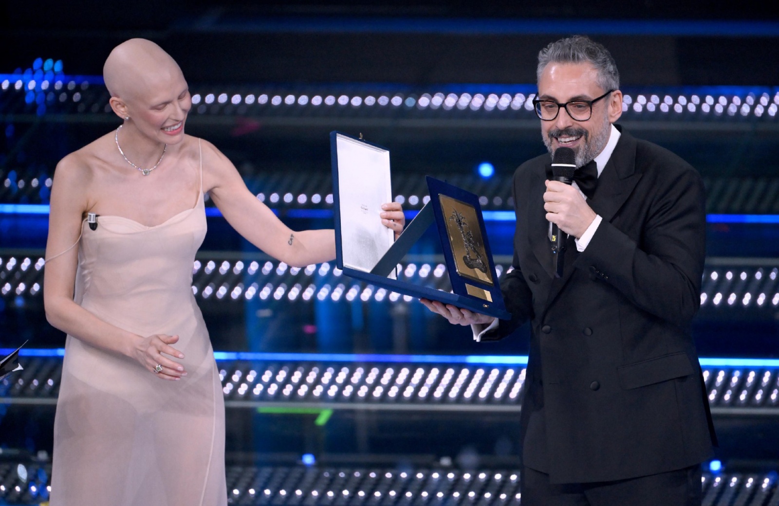 Italian singer Brunori Sas receives the Sergio Bardotti award from Italian model Bianca Balti on stage at the Ariston theatre during the 75th edition of the Sanremo Italian Song Festival, in Sanremo, Italy, 15 February 2025. The music festival will run fr