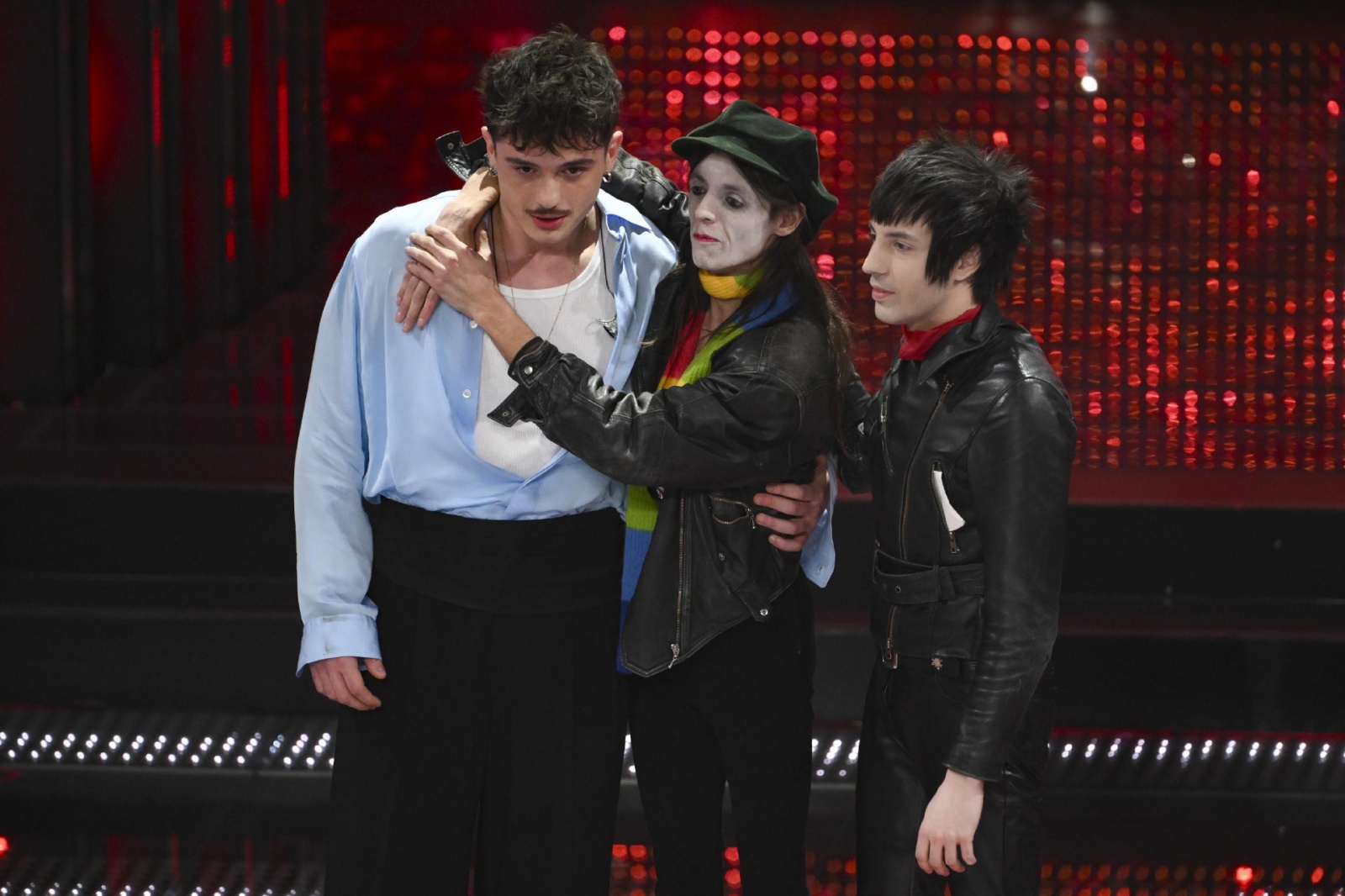 Italian singers Olly (L) and Lucio Corsi (C) on stage at the Ariston theatre during the 75th edition of the Sanremo Italian Song Festival, in Sanremo, Italy, 15 February 2025. The music festival will run from 11 to 15 February 2025. ANSA/ETTORE FERRARI
