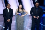 (L-R) Sanremo Festival host and artistic director Carlo Conti with Italian singer Laura Pausini and Turkish actor Can Yaman on stage at the Ariston theatre during the 76th Sanremo Italian Song Festival, Sanremo, Italy, 24 February 2026. The Music Festival